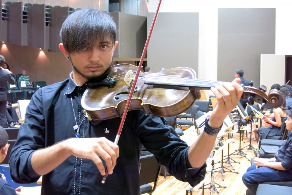 PRIMA violist Danilo practices onstage before the concert. | Photo: Andrew Huckman