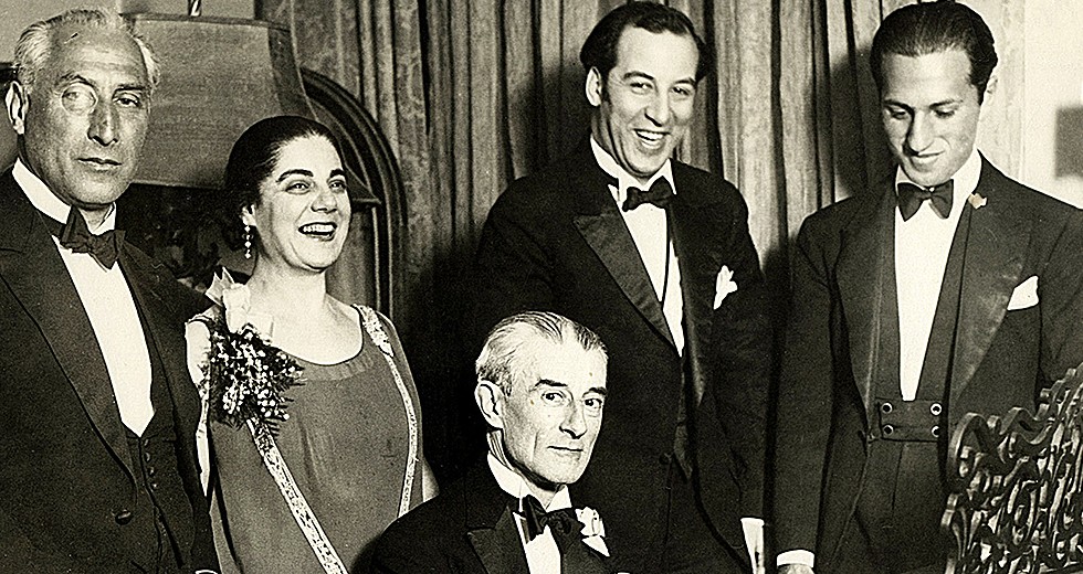 Birthday party honoring Maurice Ravel in New York City, March 8, 1928. From left: Oskar Fried; Éva Gauthier; Ravel at piano; Manoah Leide-Tedesco; and George Gershwin.
