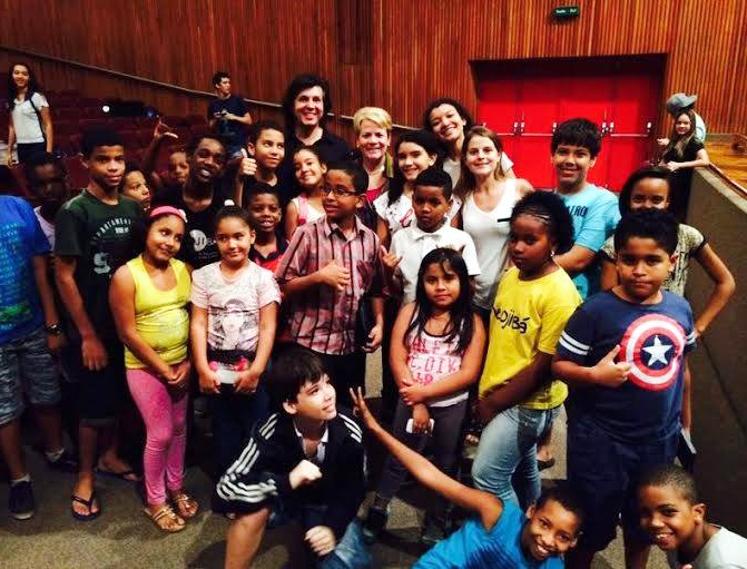 Marin Alsop poses with the future musicians of NEOJIBA, a youth orchestra program in Salvador, Brazil.