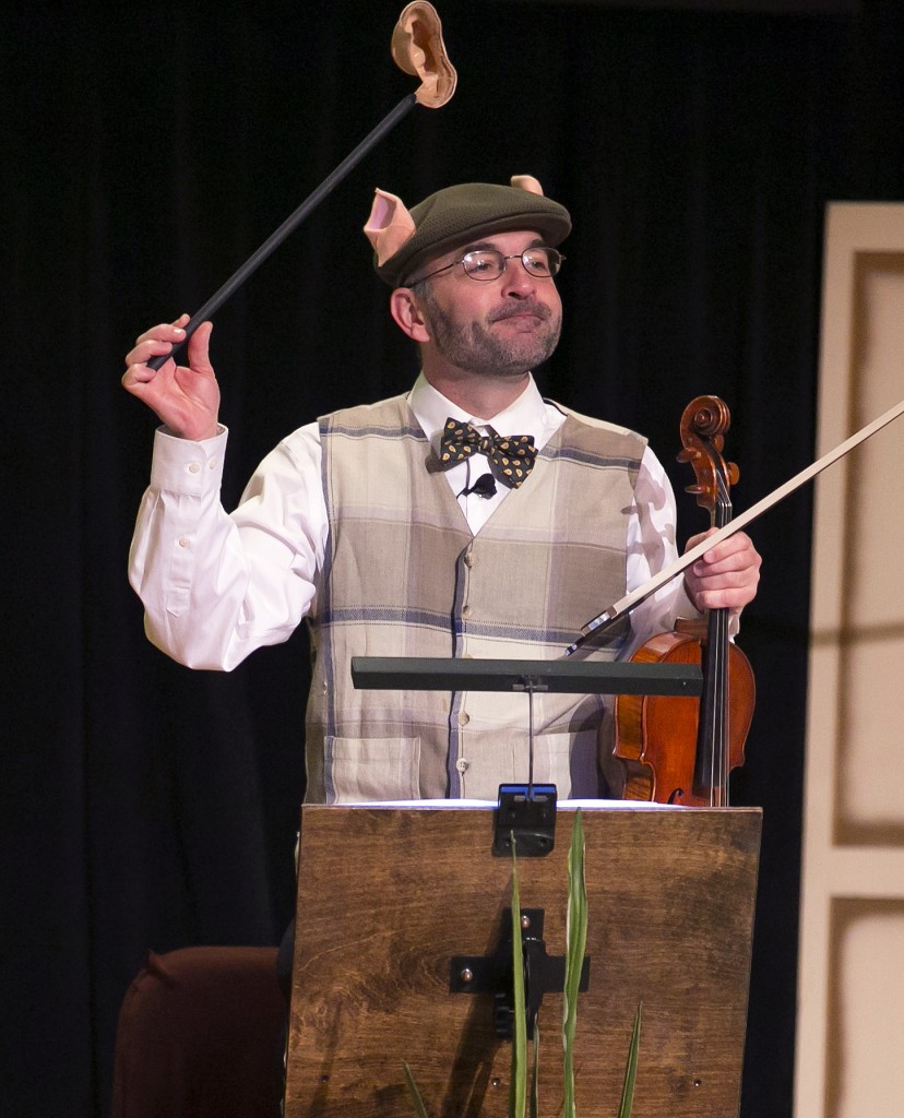 Baird Dodge, CSO principal second violin, waves a prop in "The Three Little Pigs." | © Todd Rosenberg Photography 2014