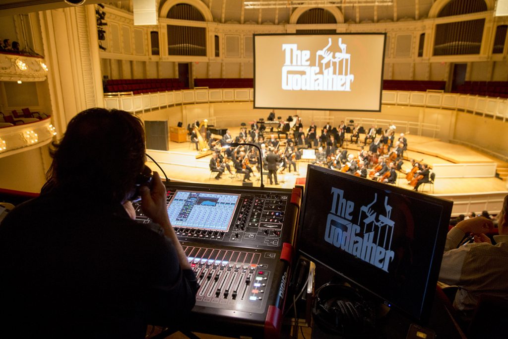 From the box tier, a technician monitors the live-to-picture presentation of "The Godfather." | © Todd Rosenberg Photography 2015