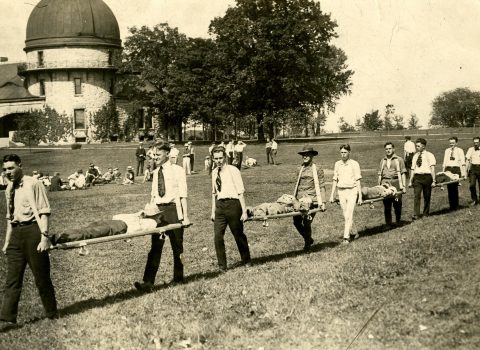 Photograph of Northwestern Ambulance Co. # 9 drill, May 1917 Taken on Northwestern’s Evanston campus; Dearborn Observatory in the background.